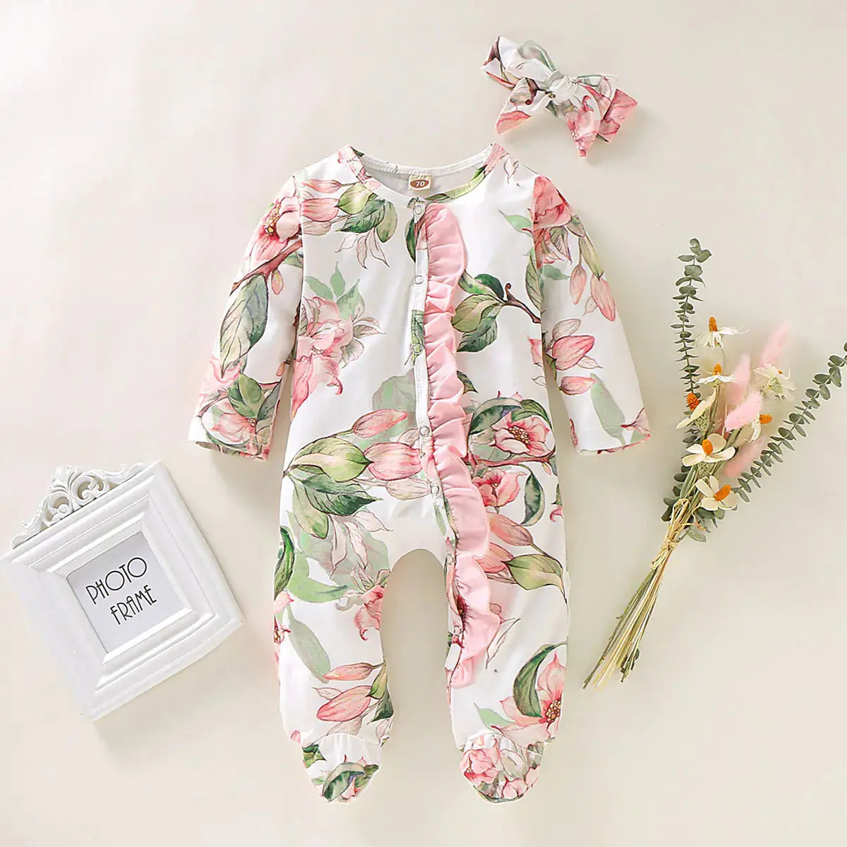 Stijlvolle bloemenprint baby jumpsuit met lange mouwen. Zacht, comfortabel en ideaal voor dagelijks gebruik. Voor baby’s van 3m tot 2 jaar.